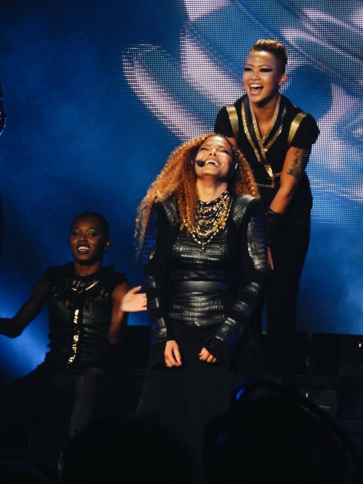 Mel mah and Janet Jackson on stage laughing together