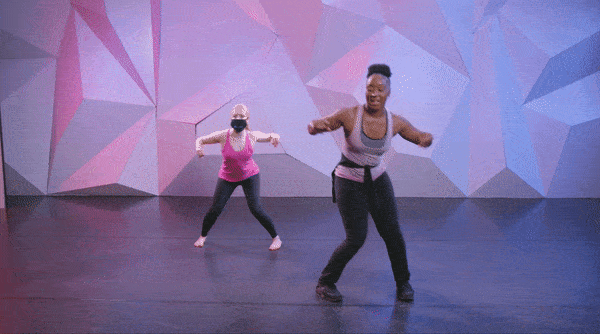 dancer saleemah knight and her assistant hopping and crossing their feet