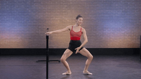 dancer tiler peck performing a plie in ballet class