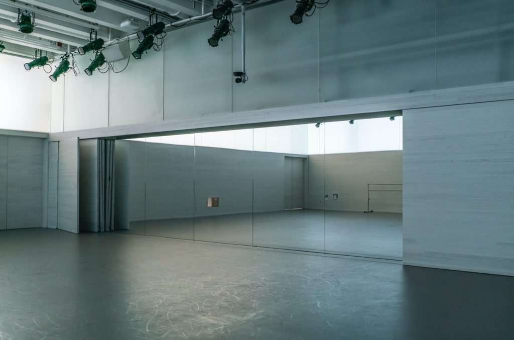 empty dance studio with full wall mirror
