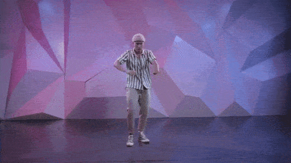 man demonstrating how to master down grooves in front of pink and purple wall. 