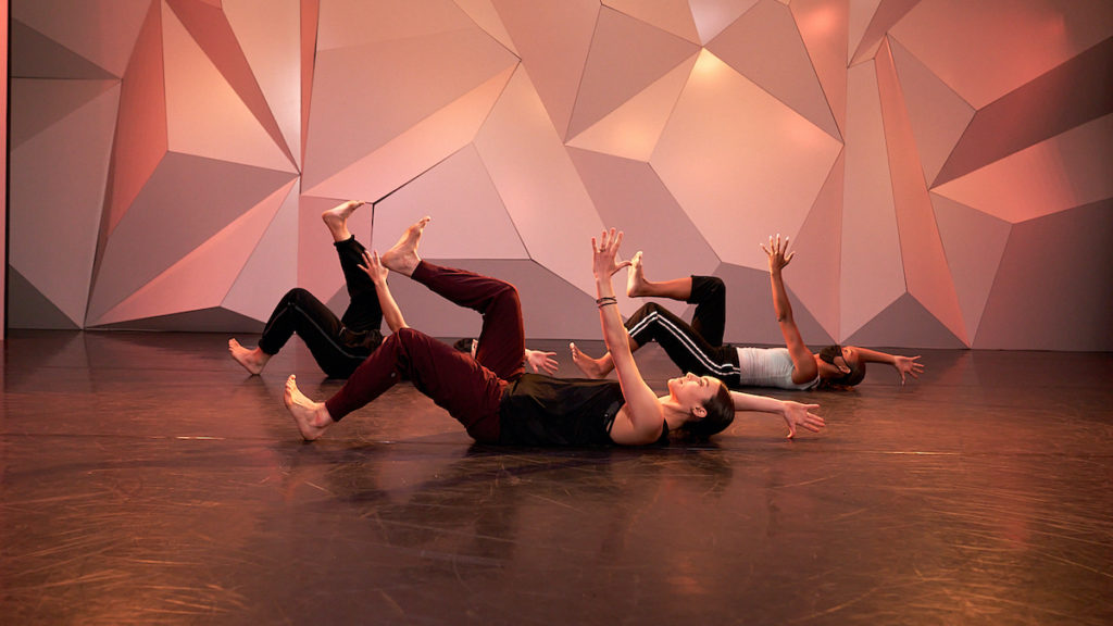 kathryn mccormick and assistants doing core work while lying on their backs at cli studios