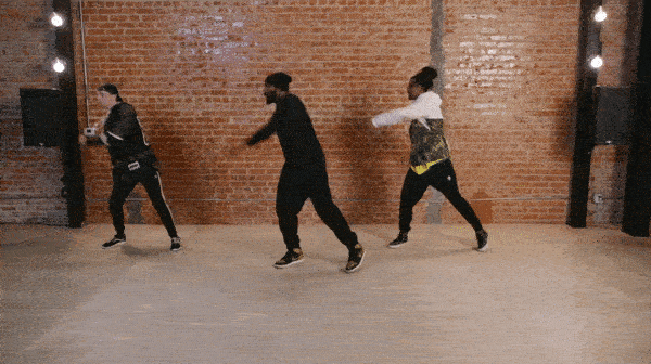 tWitch performing the biz Markie in front of brick wall.