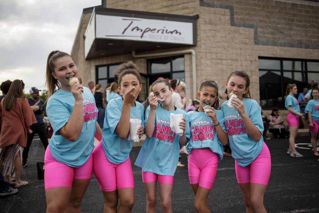 imperium house of dance dancers outside of the studio eating ice cream
