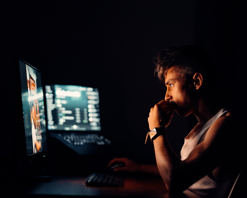 Person editing dance video at desk