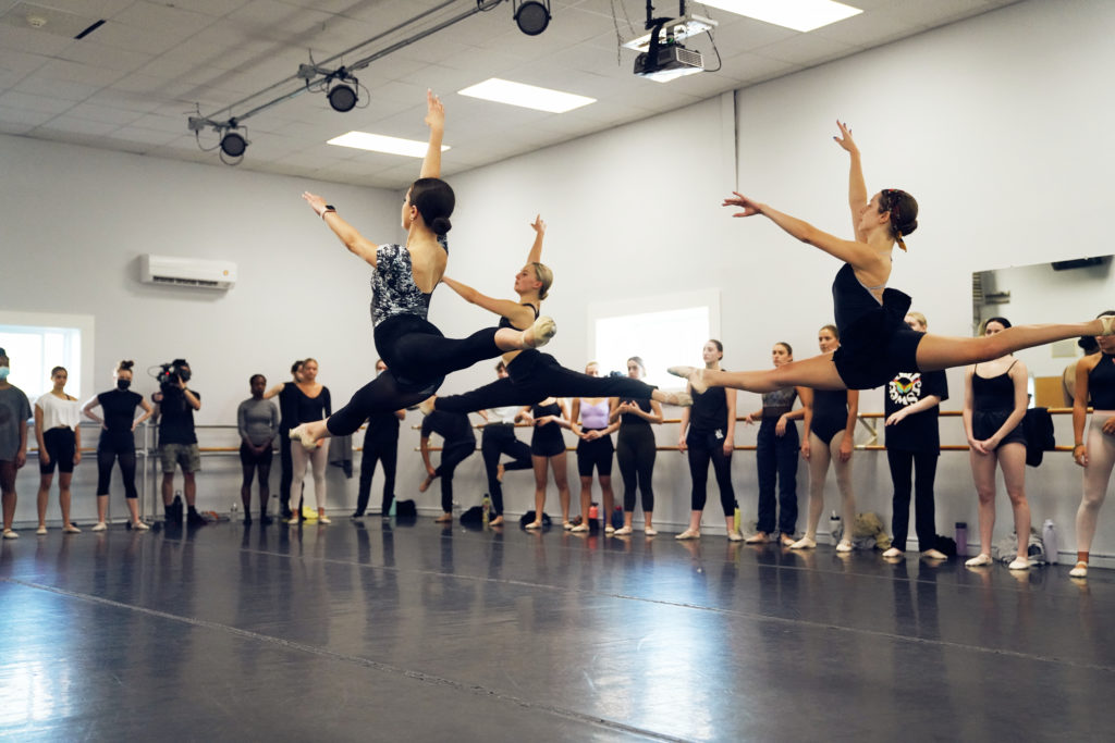 CLI Conservatory students leaping in ballet class