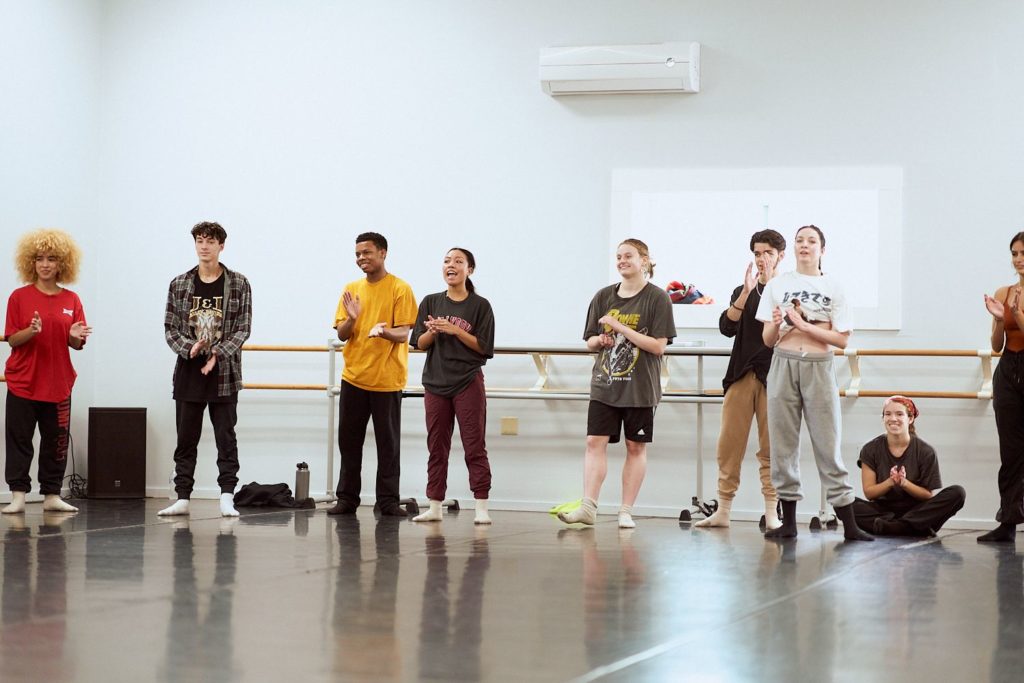 Conservatory dancers in studio clapping