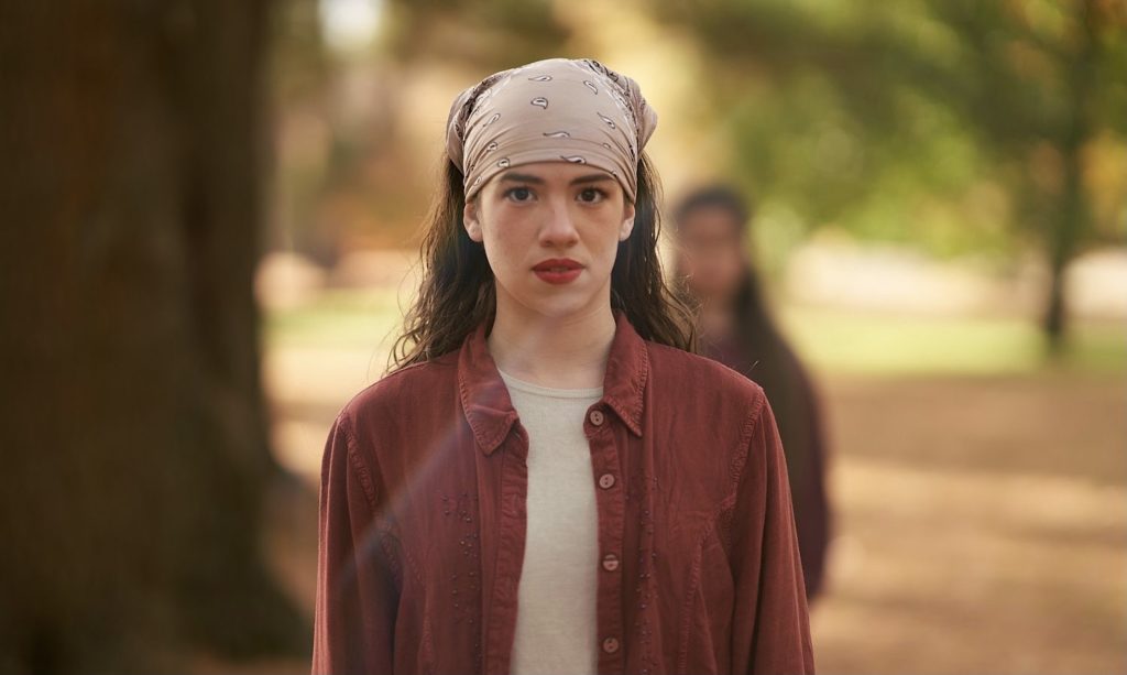 Dancer Frances Tirado in a bandana and red shirt outside
