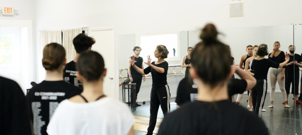 Teacher Rose Flachs in a dance studio in front of a mirror