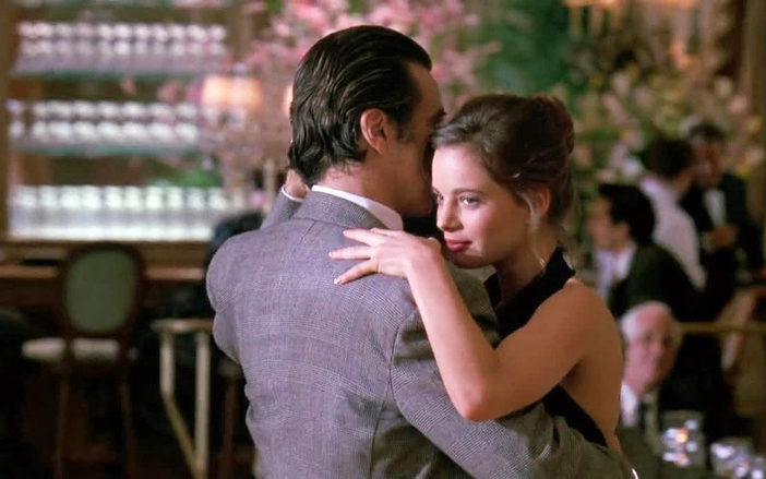 scent of a woman the tango scene with man in grey suit with back to camera and women with hair up putting her head on his shoulder.
