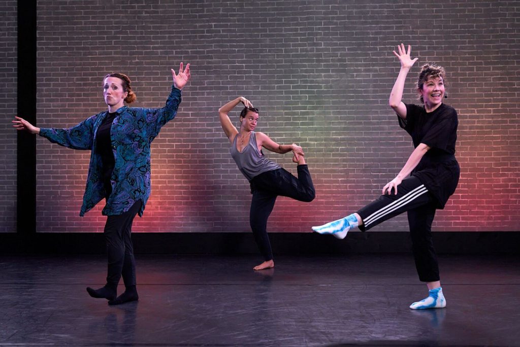 The Seaweed Sisters teaching at CLI Studios, each of the three women in a unique and silly dance pose