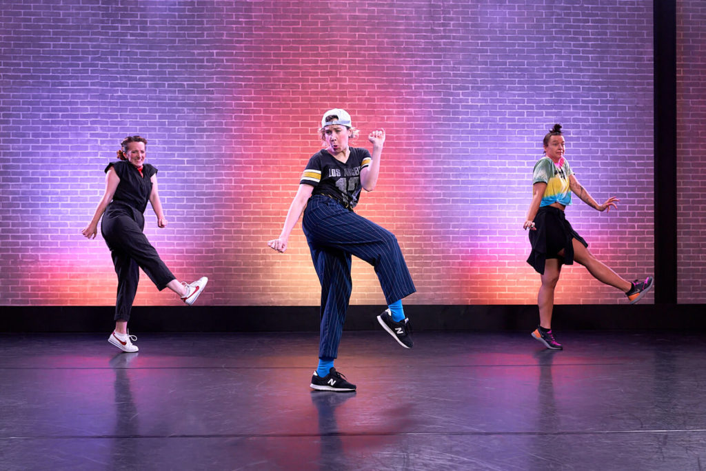 The Seaweed Sisters teaching a class at CLI Studios, all three women pose mid-step with goofy face expressions 